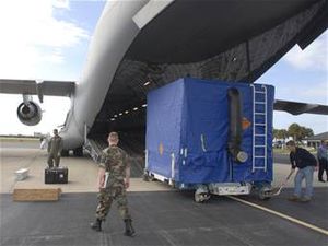 Shipping container being loaded on a USAF cargo plane.jpg
