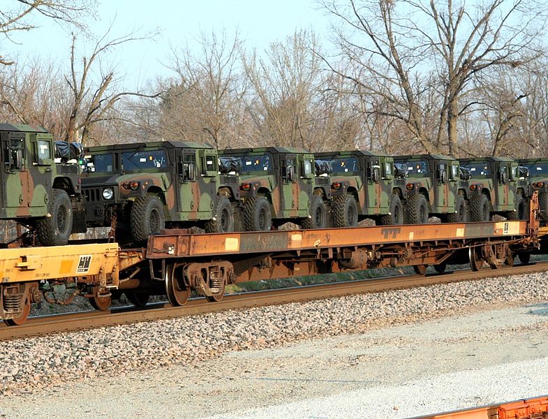 File:Military vehicles mounted on railway rail cars.jpg