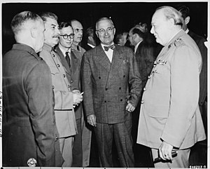 President Truman (center) speaks with Soviet Prime Minister Josef Stalin (at left) and British Prime Minister Winston... - NARA - 198775.jpg