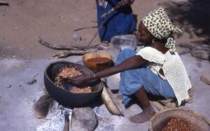 Senegalese woman prepares food CC-by-sa by John Atherton .jpg