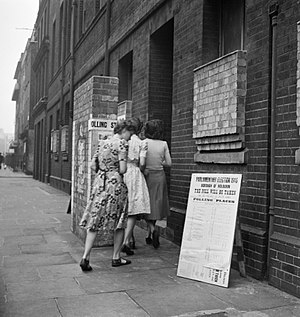Voters arriving at a polling station in the Italian Hospital, Queen Square, Holborn, London to cast their vote in the General Election of 1945. D25102.jpg