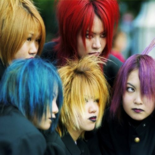 'Cosplayers' (from コスプレ kosupure 'costume roleplay') - teenagers who dress as characters from film, television or animé cartoons - pose for the cameras in Harajuku, Tokyo. These girls are dressed as members of the Japanese band 'Dir en grey'.Photo © by Sonny Santos, used by permission.