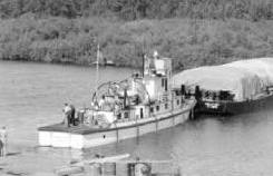 Diesel tugboat Beaver Lake, and loaded barge, leaving Waterways, Alberta, for the Arctic, 1946 - N-2013-014-0422.jpg
