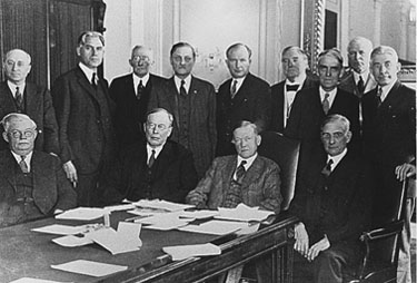 In November 1930, Senate Agriculture Committee members met with Secretary of Agriculture and representatives of farmers' organizations. Senate Shipstead is the one standing second from the left on the rear row.