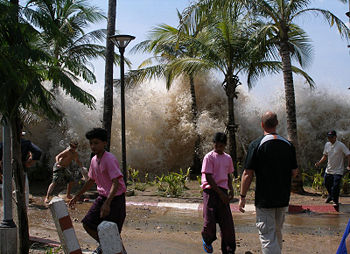 Huge spray between palm trees as people appear to be running away.