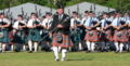 Massed pipes and drums led by drum major John Nichols]]