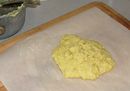 The mixture has been turned out onto a piece of buttered parchment paper