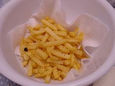Crinkle-cut fries. Potatoes, usually peeled, are cut with a special tool to form the "crinkle" shape, then prepared. They are typically about ½ inch (1.3 cm) by ½ inch (1.3 cm). These crinkle-cut fries have have been purchased frozen from a grocery and fried at home.