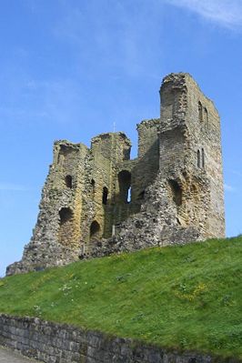 The entire west wall of Scarborough Castle's keep, as viewed from the barbican gateway, was destroyed in 1645 by artillery bombardment during the English Civil War.