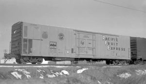 © Photo: Otto Perry / Denver Public Library A steel refrigerator car (Pacific Fruit Express #458330) sits on a siding at Denver, Colorado in March 1970. The mechanical refrigeration unit is housed at the car's "A" end, behind the grill at the lower left.