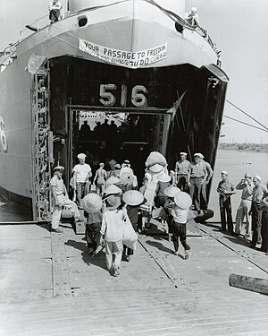 Vietnamese refugees board LST 516 during Operation Passage to Freedom, October 1954 (030630-N-0000X-001).jpg