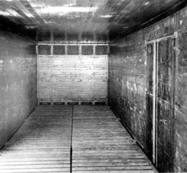 (PD) Photo: Unknown The interior of a typical ice-bunker reefer from the 1920s; the wood sheathing would give way to plywood within twenty years. Vents in the bunker at the end of the car, along with slots in the wood floor racks, allowed cool air to circulate around the contents during transit.